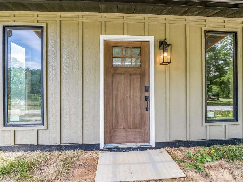 54 Old Lime Kiln Road, Arden, NC 28704.  MLS# CAR4394473, YatesRealty ID 32159. Quaint front entry.