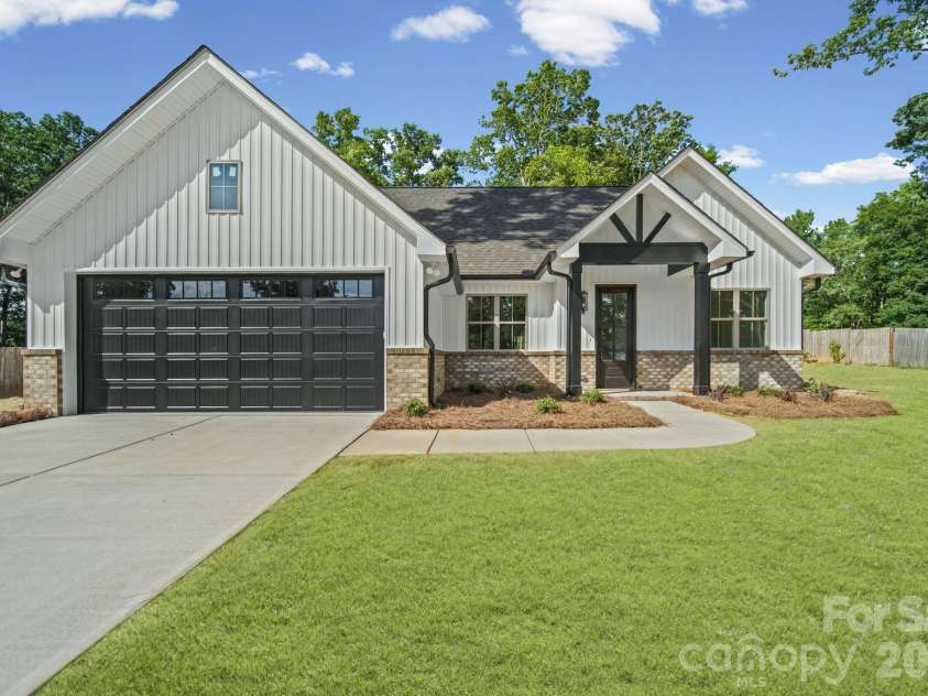851 Sorrel Lane, Oakboro, NC 28129.  MLS# CAR4394199, YatesRealty ID 32173. Virtually Staged green grass