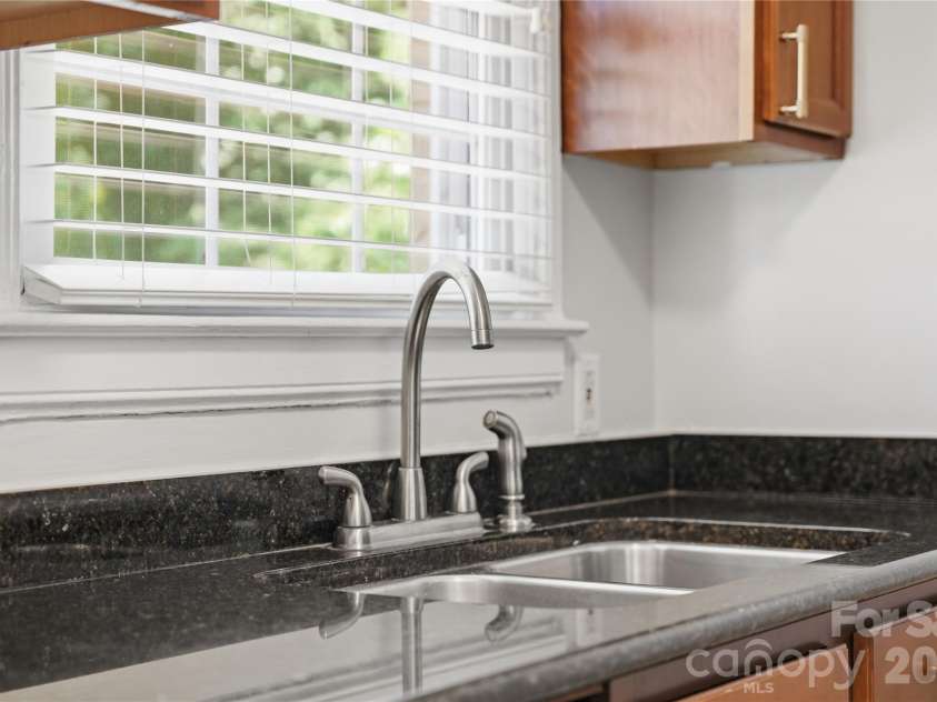 525 Wakefield Drive, Charlotte, NC 28209.  MLS# CAR4391930, YatesRealty ID 32176. Enjoy looking out to the oversized rear deck