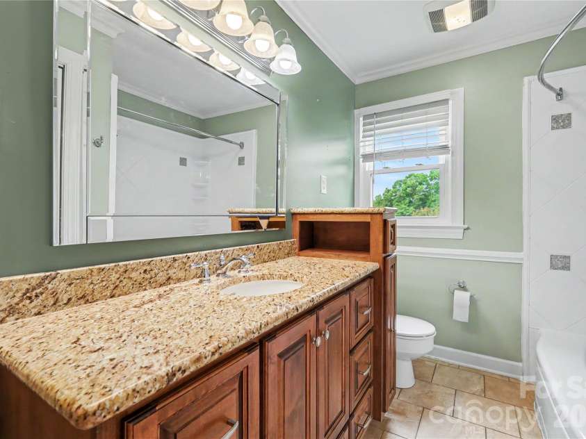 3035 River Road, Shelby, NC 28152.  MLS# CAR4393032, YatesRealty ID 32187. Renovated hall bathroom. This vanity includes a pull-out drawer beneath the sink that is actually a step stool!