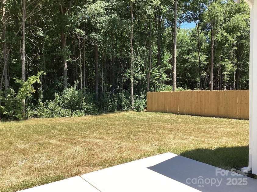 5126 Rocky River Crossing Road, Harrisburg, NC 28075.  MLS# CAR4277877, YatesRealty ID 32189. Backyard