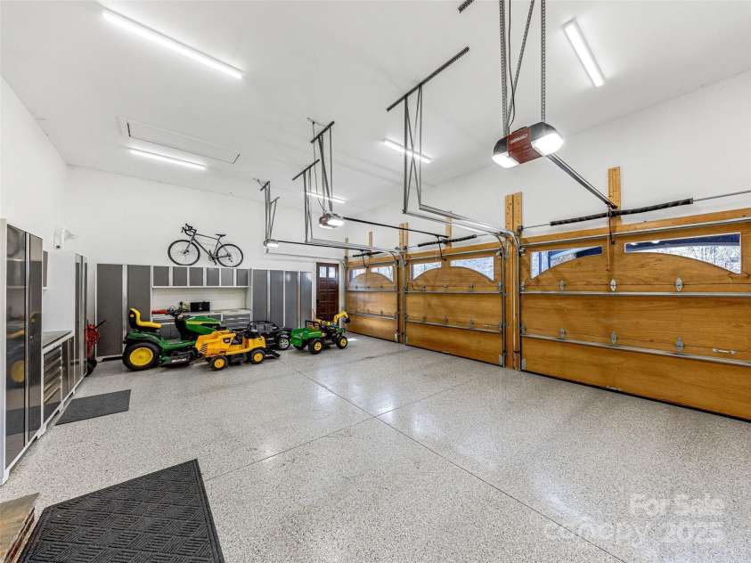 1905 White Tree Trail, Arden, NC 28704.  MLS# CAR4230669, YatesRealty ID 3219. 3 Car Garage - Custom Flooring & Storage.