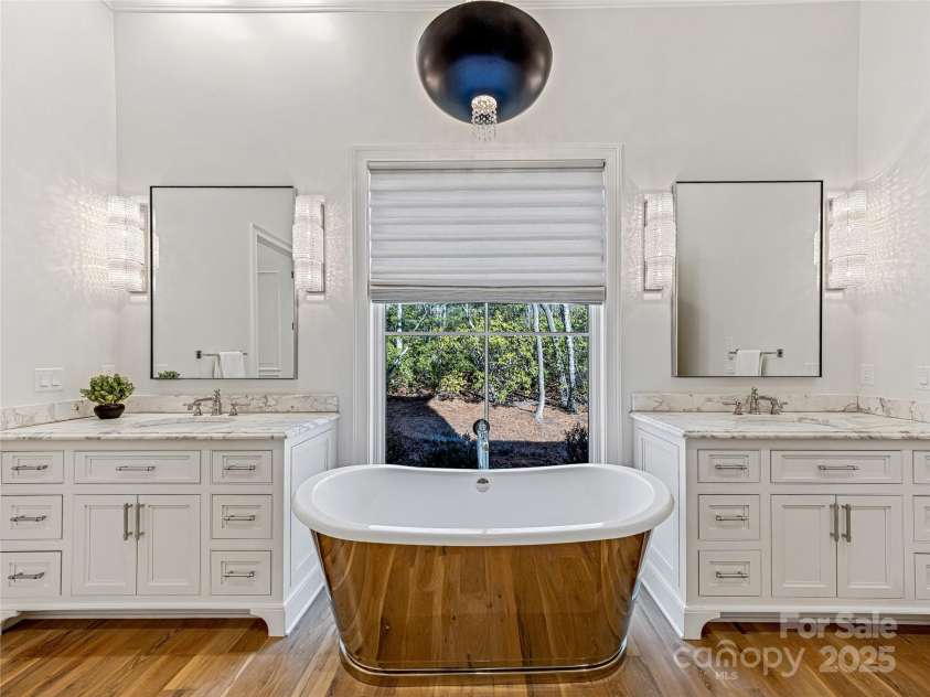 1905 White Tree Trail, Arden, NC 28704.  MLS# CAR4230669, YatesRealty ID 3219. Primary Bathroom - His & Hers sinks separated by soaking slipper tub.