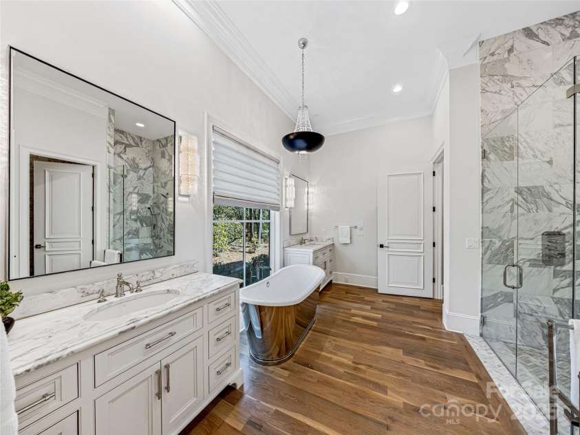 1905 White Tree Trail, Arden, NC 28704.  MLS# CAR4230669, YatesRealty ID 3219. Primary Bathroom with glass enclosed walk-in shower on the right.