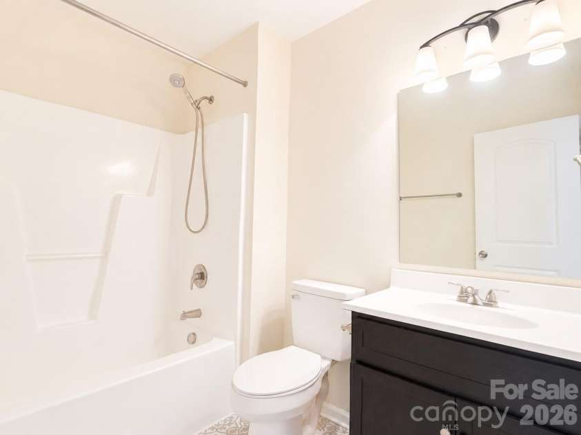 115 High Bluff Circle, Mooresville, NC 28115.  MLS# CAR4389382, YatesRealty ID 32190. Guest Bath with Tub/Shower Combo and New Tile Floors