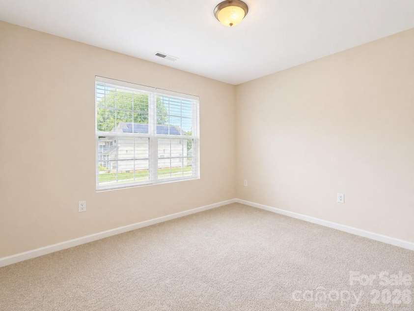 115 High Bluff Circle, Mooresville, NC 28115.  MLS# CAR4389382, YatesRealty ID 32190. Guest Bedroom with lots of Natural Light