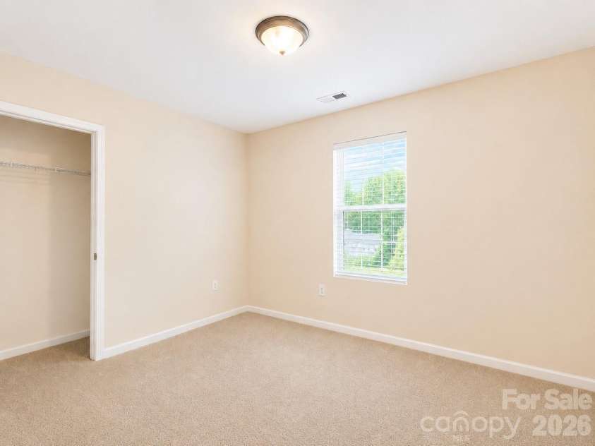 115 High Bluff Circle, Mooresville, NC 28115.  MLS# CAR4389382, YatesRealty ID 32190. Guest Bedroom with Spacious Closet