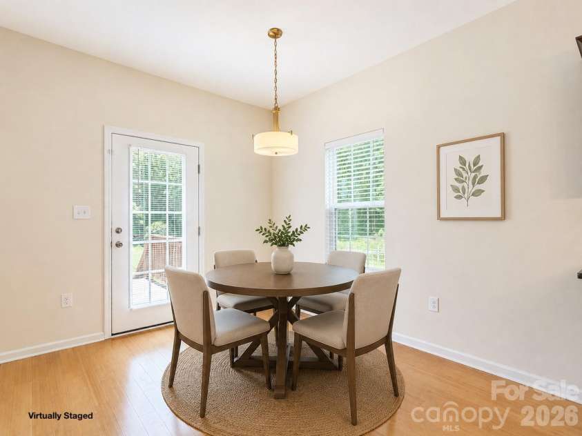 115 High Bluff Circle, Mooresville, NC 28115.  MLS# CAR4389382, YatesRealty ID 32190. Open Dinning Area Overlooking Backyard