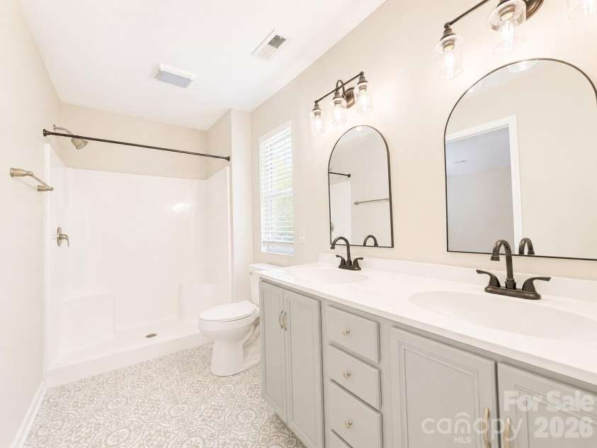 115 High Bluff Circle, Mooresville, NC 28115.  MLS# CAR4389382, YatesRealty ID 32190. Primary Bath Updated with Walk-in Shower, Dual Vanity, Tile Floors & Large Walk-in Closet