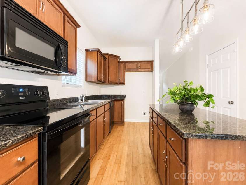 115 High Bluff Circle, Mooresville, NC 28115.  MLS# CAR4389382, YatesRealty ID 32190. Spacious Kitchen with Island 