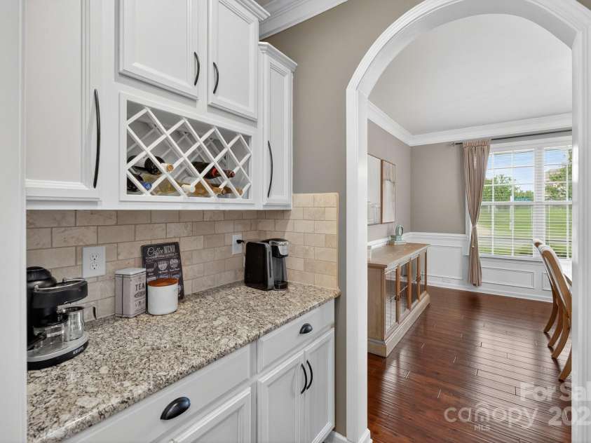 3400 Ringtail Drive, Waxhaw, NC 28173.  MLS# CAR4291096, YatesRealty ID 32194. Butler's pantry with wine storage.