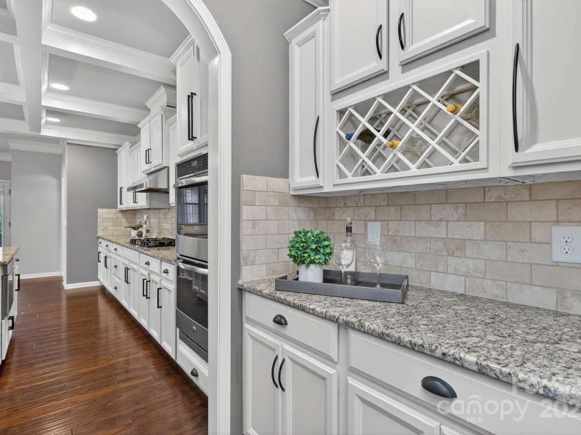 3400 Ringtail Drive, Waxhaw, NC 28173.  MLS# CAR4291096, YatesRealty ID 32194. Butler's pantry w/wine storage & walk-in pantry.