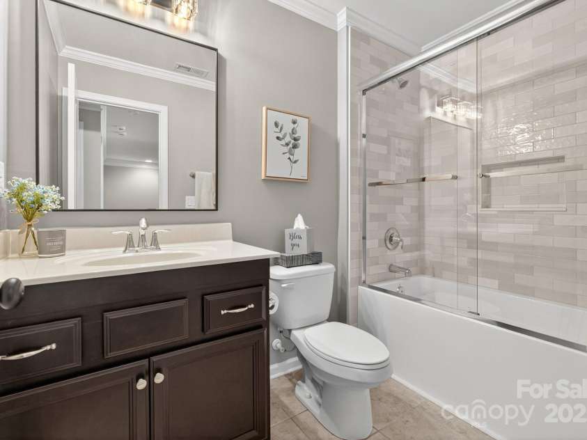 3400 Ringtail Drive, Waxhaw, NC 28173.  MLS# CAR4291096, YatesRealty ID 32194. Remodeled bath with new tub,shower tile & lighting