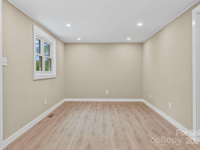 530 Rebel Ridge Road, Marshall, NC 28753.  MLS# CAR4280737, YatesRealty ID 32197. Front door entry into living room w/new LVP throughout house