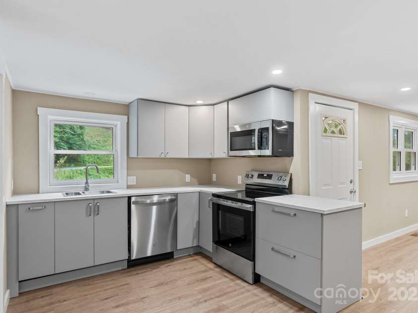 530 Rebel Ridge Road, Marshall, NC 28753.  MLS# CAR4280737, YatesRealty ID 32197. Generous cabinets and counters