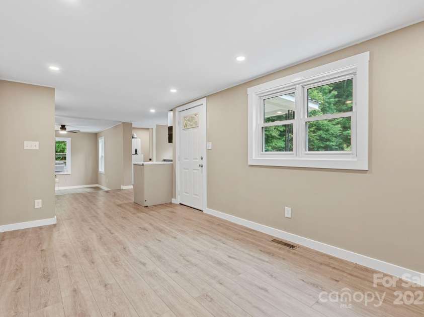 530 Rebel Ridge Road, Marshall, NC 28753.  MLS# CAR4280737, YatesRealty ID 32197. Open concept plan w/view through kitchen to dining area