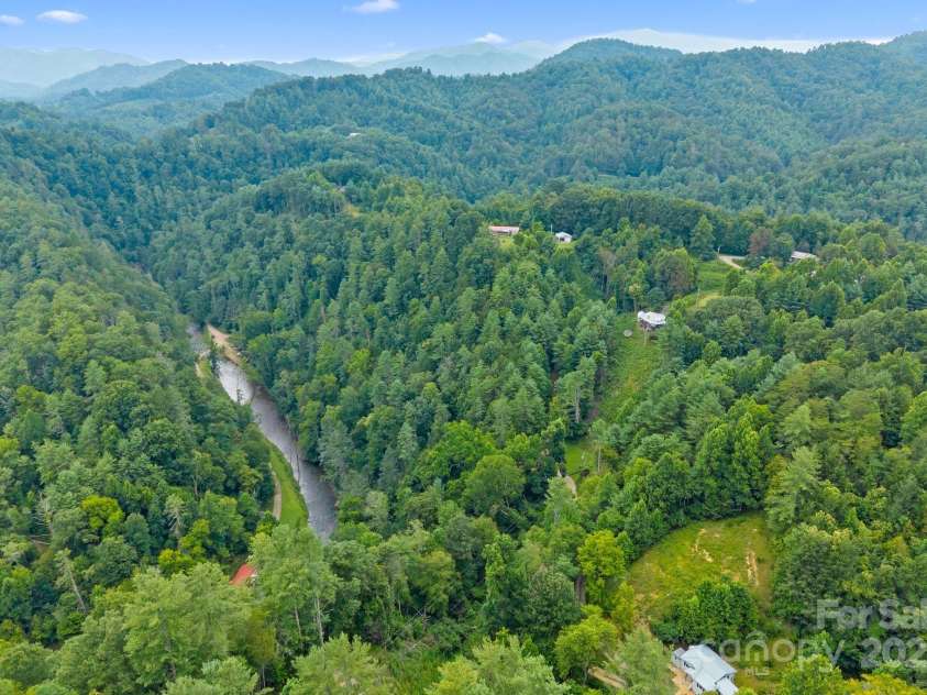 530 Rebel Ridge Road, Marshall, NC 28753.  MLS# CAR4280737, YatesRealty ID 32197. Propery goes down a steep bank to Big Laurel Creek