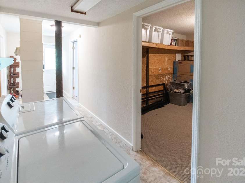 87 Pauline Circle, Franklin, NC 28734.  MLS# CAR4287412, YatesRealty ID 32198. Laundry