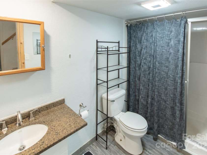 87 Pauline Circle, Franklin, NC 28734.  MLS# CAR4287412, YatesRealty ID 32198. Lower Level Bath