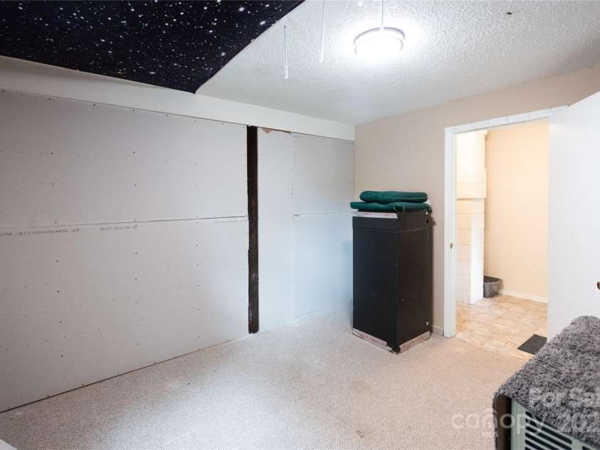 87 Pauline Circle, Franklin, NC 28734.  MLS# CAR4287412, YatesRealty ID 32198. Lower level Bonus Room