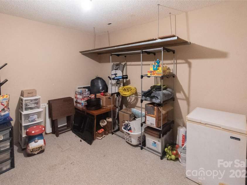 87 Pauline Circle, Franklin, NC 28734.  MLS# CAR4287412, YatesRealty ID 32198. Lower Level Storage Room