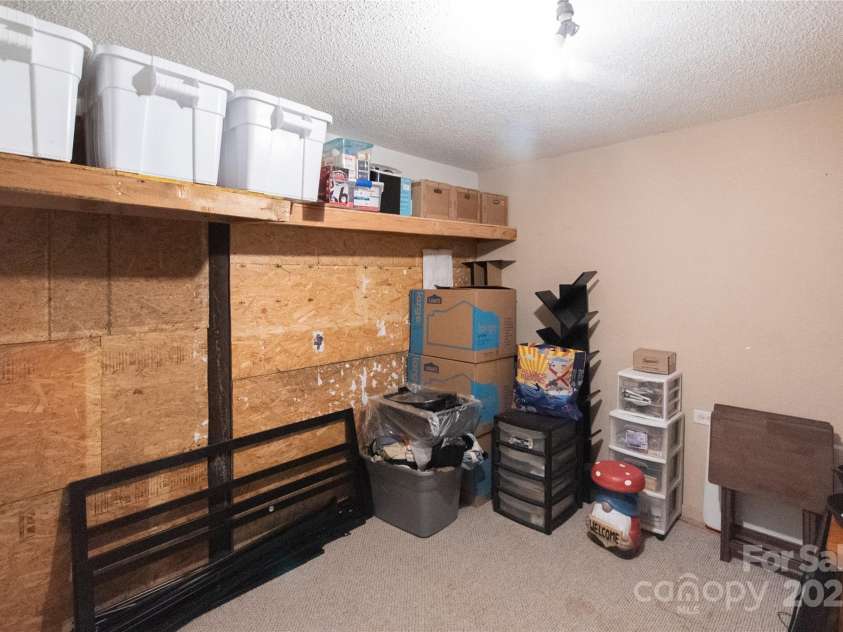 87 Pauline Circle, Franklin, NC 28734.  MLS# CAR4287412, YatesRealty ID 32198. Lower Level Storage Room