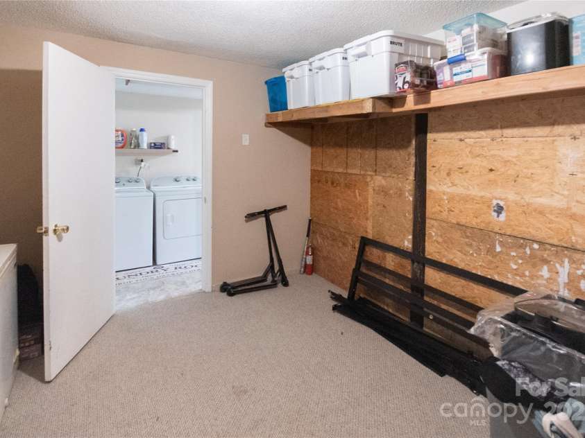 87 Pauline Circle, Franklin, NC 28734.  MLS# CAR4287412, YatesRealty ID 32198. Lower Level Storage Room