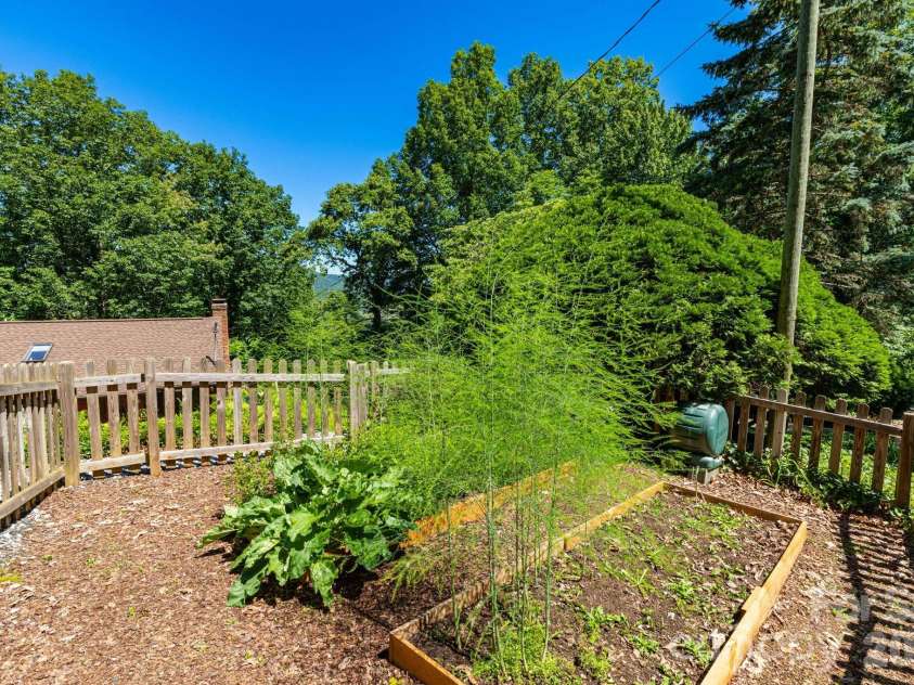 168 Blossom Ridge, Leicester, NC 28748.  MLS# CAR4389201, YatesRealty ID 32199. Fenced Garden