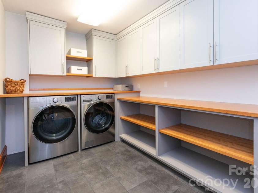 168 Blossom Ridge, Leicester, NC 28748.  MLS# CAR4389201, YatesRealty ID 32199. Laundry Room with custom cabinets