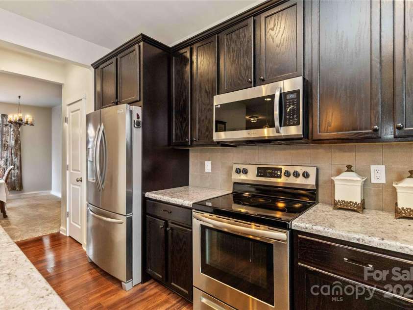 4626 Gibbons Link Road, Charlotte, NC 28269.  MLS# CAR4290378, YatesRealty ID 32205. Abundant cabinetry with a dedicated pantry.