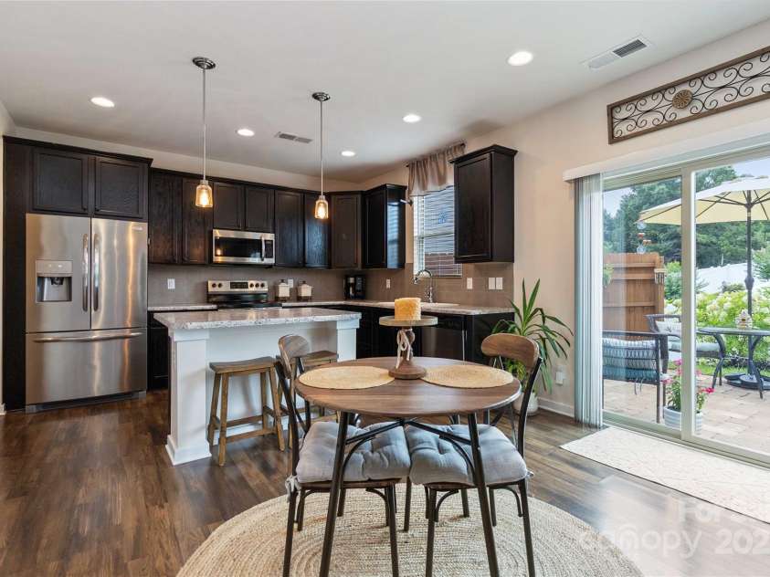 4626 Gibbons Link Road, Charlotte, NC 28269.  MLS# CAR4290378, YatesRealty ID 32205. Breakfast area opens to stone patio.