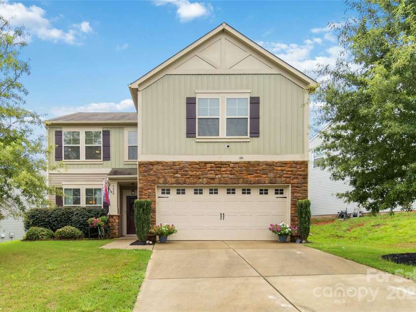 4626 Gibbons Link Road, Charlotte, NC 28269.  MLS# CAR4290378, YatesRealty ID 32205. Inviting two-story home with stone accents and siding  detailing—strong curb appeal.