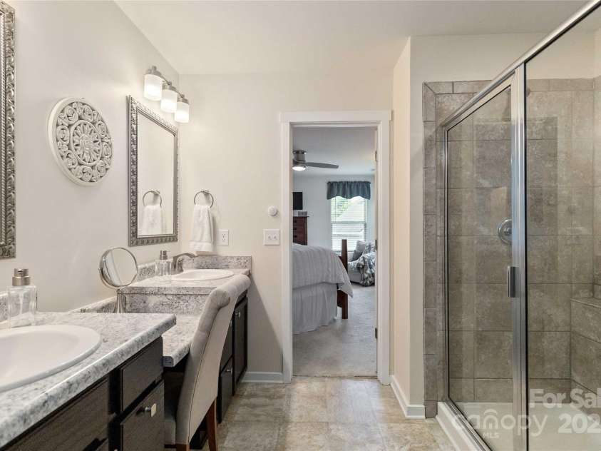 4626 Gibbons Link Road, Charlotte, NC 28269.  MLS# CAR4290378, YatesRealty ID 32205. Primary bath with large walk-in tiled shower.