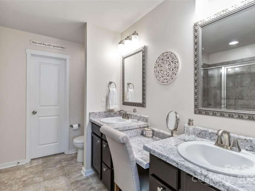 4626 Gibbons Link Road, Charlotte, NC 28269.  MLS# CAR4290378, YatesRealty ID 32205. Primary ensuite bath with dual vanities.