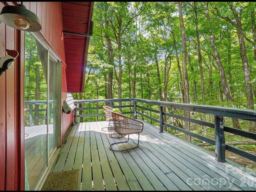 201 Hampton Gap Drive, Mars Hill, NC 28754.  MLS# CAR4390377, YatesRealty ID 32206. Side Deck w/Tree Canopy