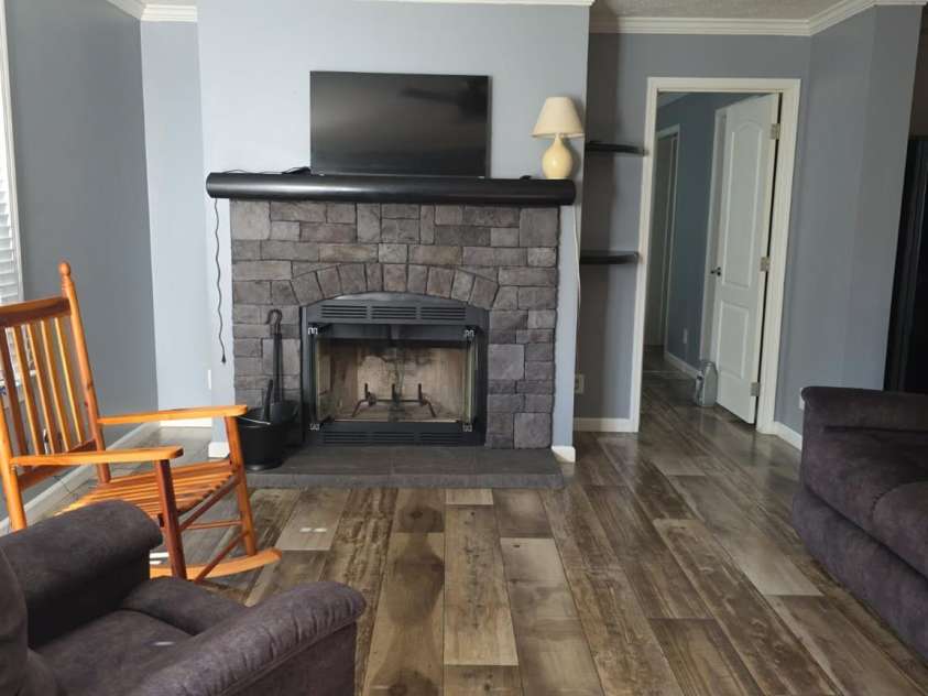 2939 Landfill Road, Mt Croghan, SC 29727.  MLS# CAR4291002, YatesRealty ID 32207. Great room with fireplace looking towards primary bedroom suite