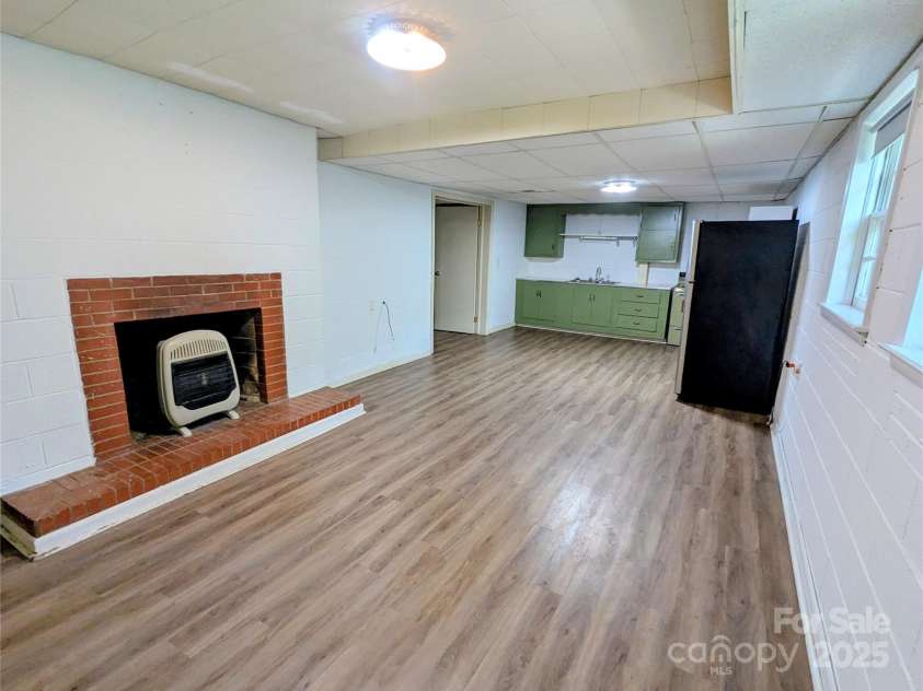 505 Richards Drive, Shelby, NC 28150.  MLS# CAR4287142, YatesRealty ID 32211. Basement living space with gas fireplace