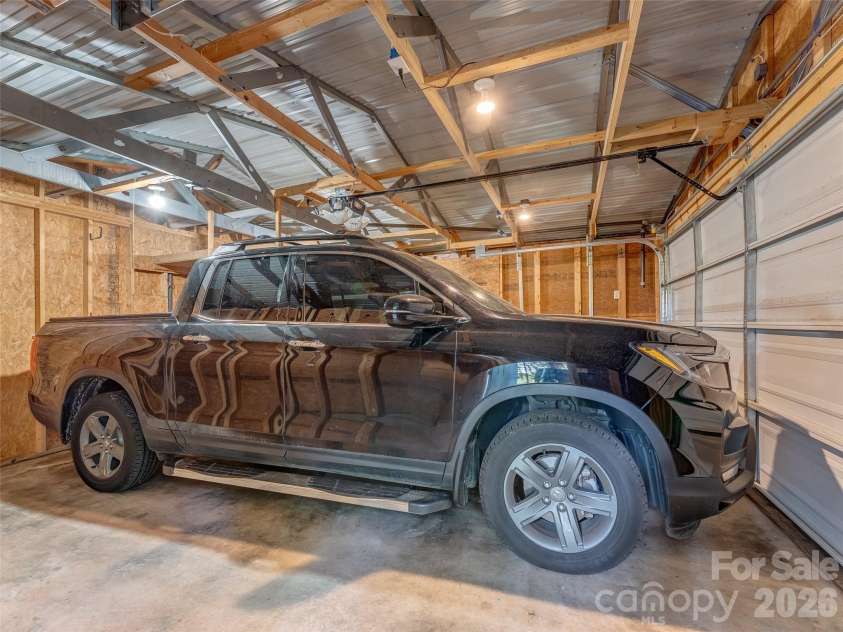 387 Crystal Creek Drive, Pisgah Forest, NC 28768.  MLS# CAR4373550, YatesRealty ID 32225. Detached garage