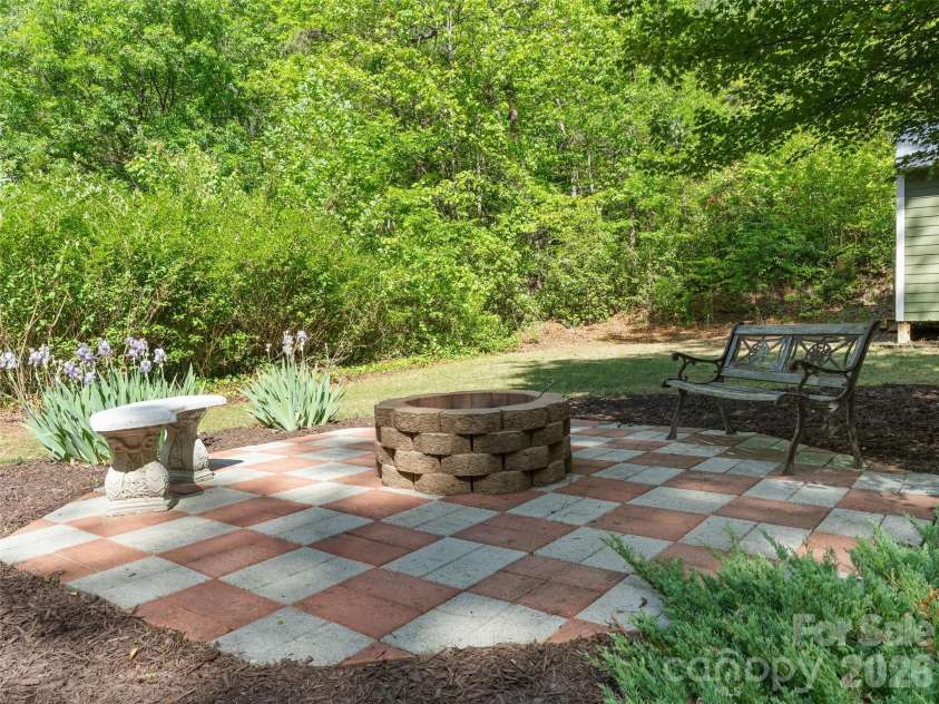 387 Crystal Creek Drive, Pisgah Forest, NC 28768.  MLS# CAR4373550, YatesRealty ID 32225. Fire pit