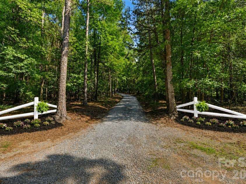 408 Birmingham Lane, Monroe, NC 28110.  MLS# CAR4394323, YatesRealty ID 32226. Driveway entrance