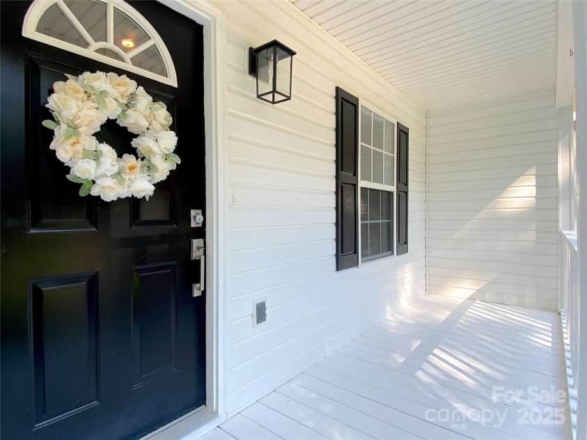 4445 Homestead Road, Rock Hill, SC 29732.  MLS# CAR4230558, YatesRealty ID 32226. Covered rocking chair front porch!