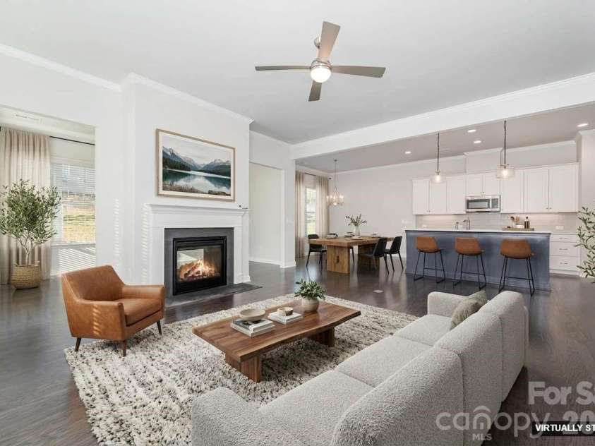 456 Lucky Drive, Concord, NC 28027.  MLS# CAR4313263, YatesRealty ID 32227. Virtually staged great room and kitchen view.