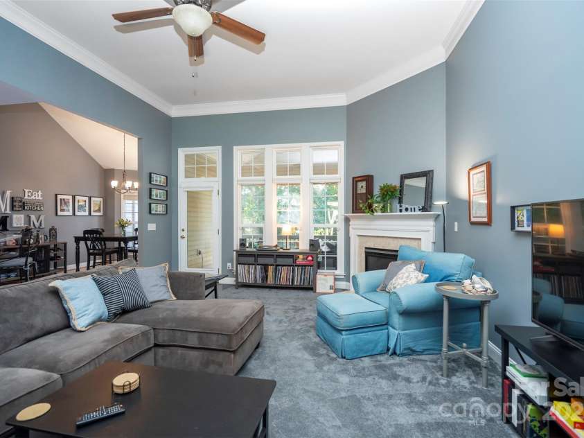 126 Doyle Farm Lane, Mooresville, NC 28115.  MLS# CAR4270254, YatesRealty ID 32228. Great Room with high ceilings, corner gas fireplace and new plush carpeting.