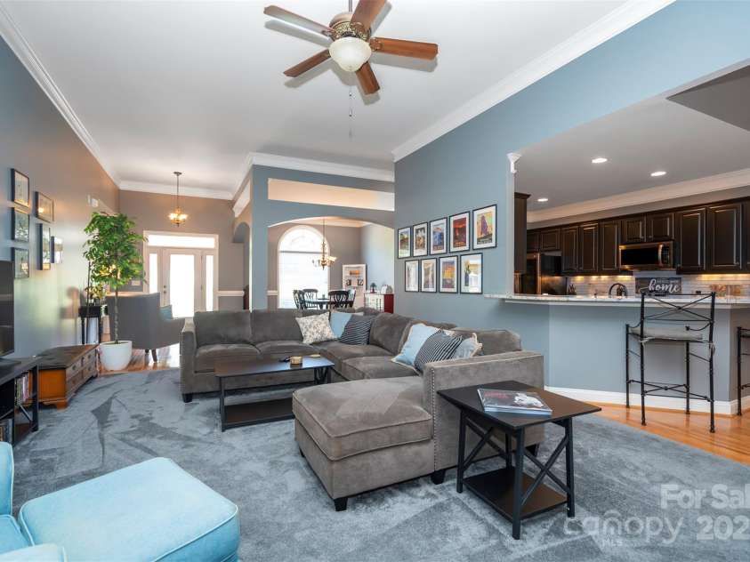 126 Doyle Farm Lane, Mooresville, NC 28115.  MLS# CAR4270254, YatesRealty ID 32228. Great Room with high ceilings, corner gas fireplace and new plush carpeting.