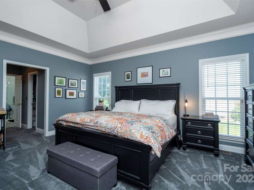 126 Doyle Farm Lane, Mooresville, NC 28115.  MLS# CAR4270254, YatesRealty ID 32228. Primary Bedroom features deep trey ceiling and new plush carpeting.