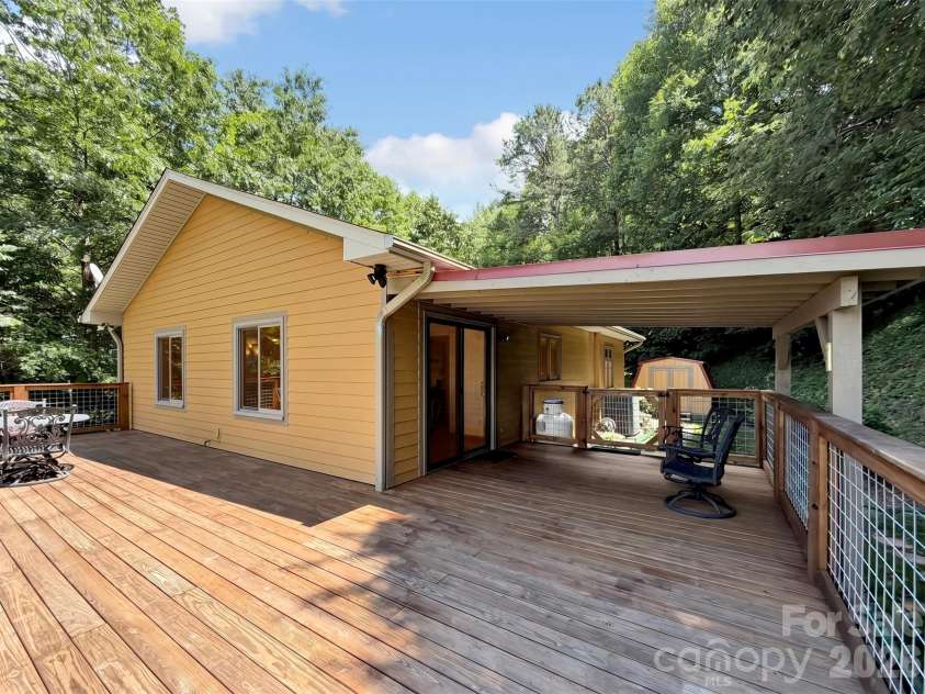 372 Shady Ridge Road, Waynesville, NC 28785.  MLS# CAR4393581, YatesRealty ID 32230. Side and covered deck