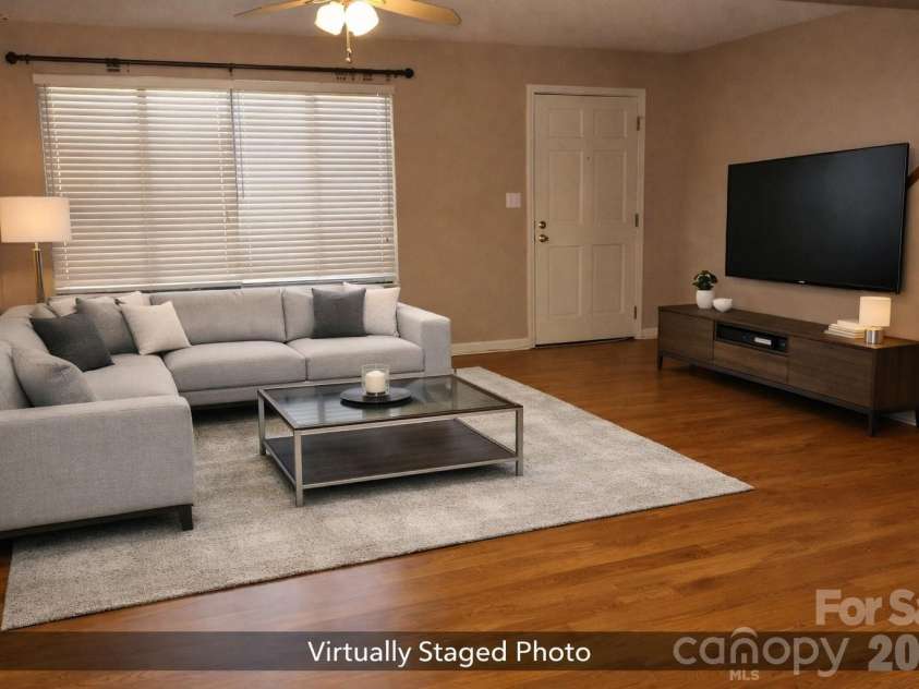 407 Broad Street, Statesville, NC 28677.  MLS# CAR4390712, YatesRealty ID 32232. Great room virtually staged