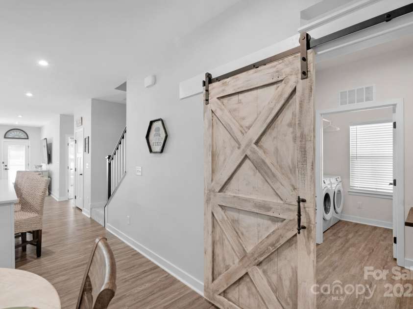 1526 Dennis Austin Lane, Indian Trail, NC 28079.  MLS# CAR4290073, YatesRealty ID 32238. Barn doors to Laundry