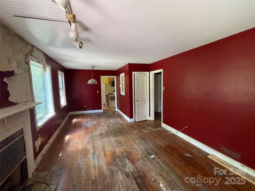 1026 Sylvan Boulevard, Hendersonville, NC 28791.  MLS# CAR4286487, YatesRealty ID 32240. Living room and dining area