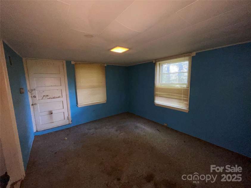 1026 Sylvan Boulevard, Hendersonville, NC 28791.  MLS# CAR4286487, YatesRealty ID 32240. Lower level bedroom